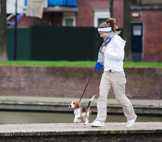 Woman Walking With A Dog