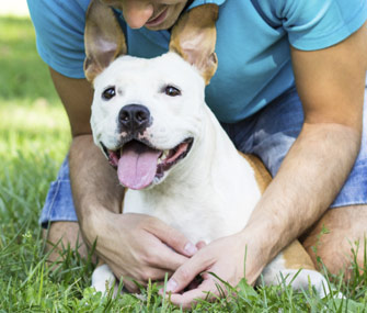 Man hugging dog